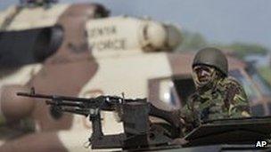 A Kenyan soldier on an armoured vehicle at their base near the Bur Garbo, Somalia, 14 Dec 2011