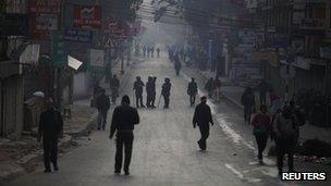Nepalese police personnel are seen along the roads of Kathmandu during a countrywide strike against the Nepali government and police in Kathmandu December 19, 2011.