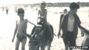 Tony Oliver (left) on a beach with his brother, Bernard Oliver (right)