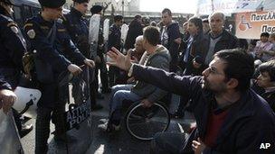Wheelchair users join a protest rally in central Athens (13 Dec)