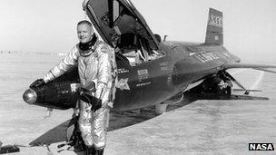 Neil Armstrong standing by the X-15