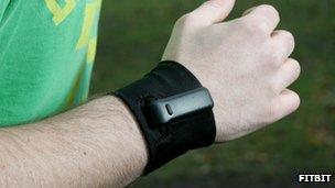 The Fitbit Ultra on a man's wrist