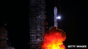 A satellite carrying rocket blasts off from the Xichang Satellite Launch Centre