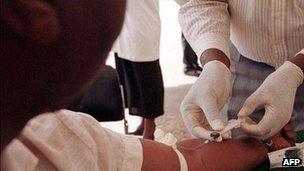 Blood drawn from a Kenyan to determine his HIV status (December 2000)