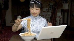 Chinese woman using computer
