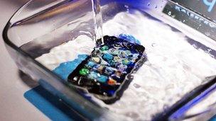 An iPhone submerged in water
