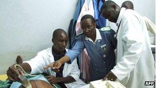Malawian medical staff treat a patient