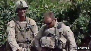 Still from video allegedly showing US Marines urinating on Taliban corpses