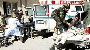 Medics prepare to carry wounded fighters to hospital in Gharyan. Photo: 14 January 2012