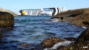 The capsized Costa Concordia lies off the coast of the island of Giglio