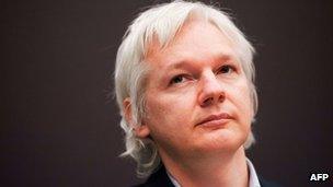 Julian Assange attends a press conference in London, 1 December