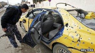 Car destroyed by bomb attack in Kirkuk