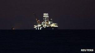 A Chinese-built drilling rig known as Scarabeo 9, is seen lit up off the coast of Havana 22 January 2012.