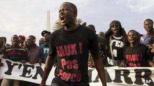 Protesters opposed to President Abdoulaye Wade running for a third term shout slogans during a rally in Dakar, Senegal Tuesday 31 January 2012