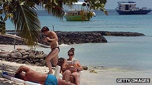 Tourists on a beach in the Maldives