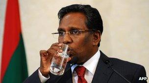 Newly appointed Maldives President Mohamed Waheed has a drink during a press conference at his office in Male on February 8, 2012.