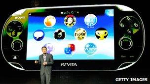 Kazuo Hirai with the PlayStation Vita