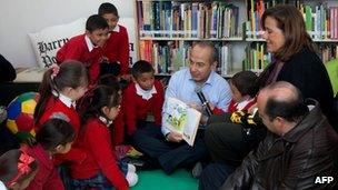 President Felipe Calderon reads to children at a public school in Ciudad Juarez