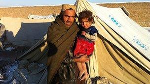 Samar Gul with his daughter