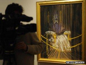 Cameraman with Francis Bacon's painting Study after Velazquez's Portrait of Pope Innocent X