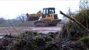 Digger at Strashleigh Hams where rubble was dumped