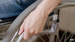 Man's hand on wheelchair