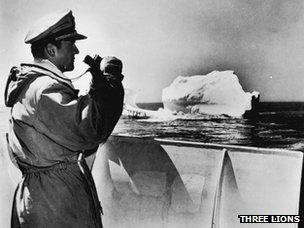 A member of the International Ice Patrol monitors an iceberg