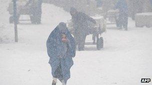A woman in a snow storm in Kabul, Afghanistan (Feb 2012)