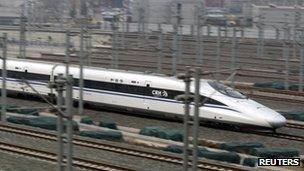 A China Railway High-speed (CRH) Harmony bullet train travels towards Beijing South Railway Station, 24 Feb 2012