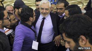 Abdel Moneim Aboul Fotouh surrounded by young supporters at a campaign rally
