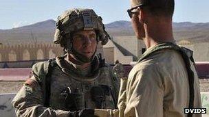 Photo said to show Sgt Robert Bales posted on a military website (left)