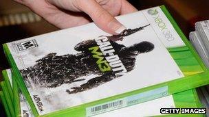 A gamer picks up a copy of Call of Duty