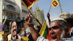 A supporter of Sri Lanka's President Mahinda Rajapaksa protests against the Geneva meeting