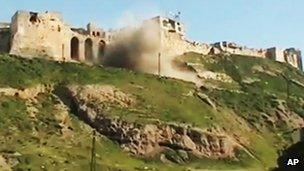Shell striking castle in Hama