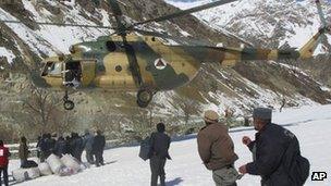 Afghan military helicopter carrying emergency supplies (file photo March 2012)