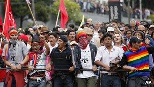 Indigenous and non-indigenous people protest the policies of President Rafael Correa as they march near the National Assembly March 22, 2012