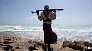 A Somali pirate gazing at the captured MV Filitsa, 7 January 2010