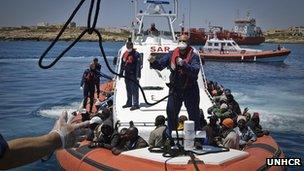 refugees on Italian coastguard boat