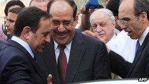 Nouri Maliki (centre) in Baghdad (27 March 2012)