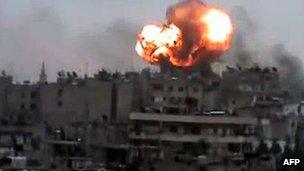 Screengrab of video purportedly showing a fireball rises from the Syrian city of Homs during a bombardment by government forces (29 March 2012)