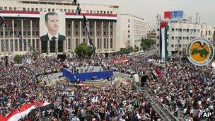 Assad supporters attend a rally in Damascus, 7 April