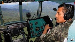 Peru's President Ollanta Humala takes part in a military operation to search for a group of workers abducted by Maoist Shining Path guerrillas