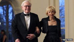 Warren Buffett and his wife attend a White House dinner for Prime Minister David Cameron 15 March 2012