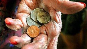 Elderly woman holding money