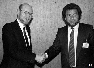 Clive Sinclair shakes hands with Alan Sugar