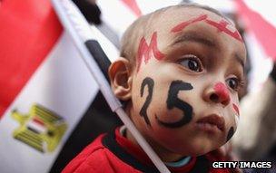 A young child with his face painted as Egyptians mark first anniversary of the revolution in Cairo, Egypt, on 25 January 2012