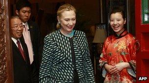 US Secretary of State Hillary Clinton proceeds to a dinner with State Councilor Dai in Beijing