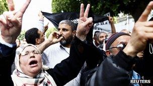 Salafists protest against Nabil Karoui, the owner of Nessma, outside a court in Tunis on 19 April 2012
