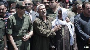Egypt's military ruler, Field Marshal Mohamed Hussein Tantawi (L) attends the funeral of a member of Egypt"s special forces in Cairo on May 5, 2012