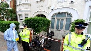 Police officers outside the house where the children were found